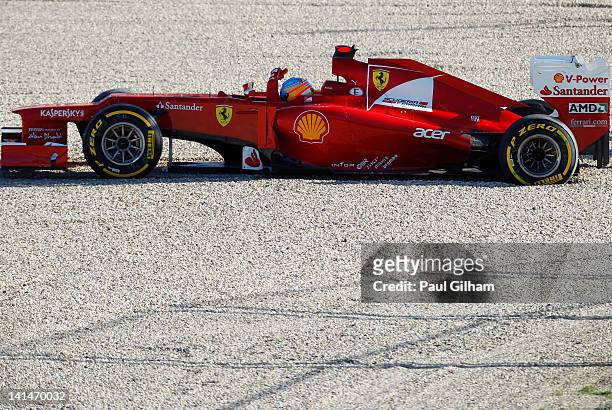 Fernando Alonso of Spain and Ferrari retires early after spinning out into gravel trap during qualifying for the Australian Formula One Grand Prix at...