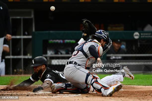 Leury Garcia of the Chicago White Sox beats the tag from Eric Haase of the Detroit Tigers to score in the second inning at Guaranteed Rate Field on...