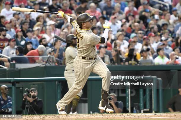 Manny Machado of the San Diego Padres hits a solo home run in the third inning during a baseball game against the Washington Nationals at Nationals...