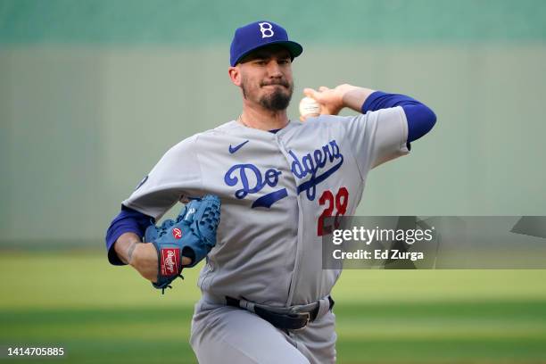 Starting pitcher Andrew Heaney of the Los Angeles Dodgers warms up prior to throwing against the Kansas City Royals in the first inning at Kauffman...