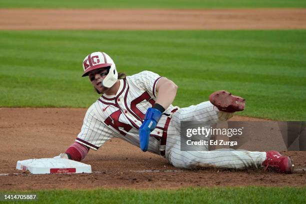 Bobby Witt Jr. #7 of the Kansas City Royals slides into third as he advances on a Salvador Perez of the Kansas City Royals single in the fifth inning...