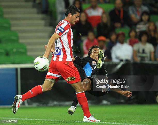 Nick Carle of Sydney contests with Simon Colosimo of Heart during the round 24 A-League match between the Melbourne Heart and Sydney FC at AAMI Park...