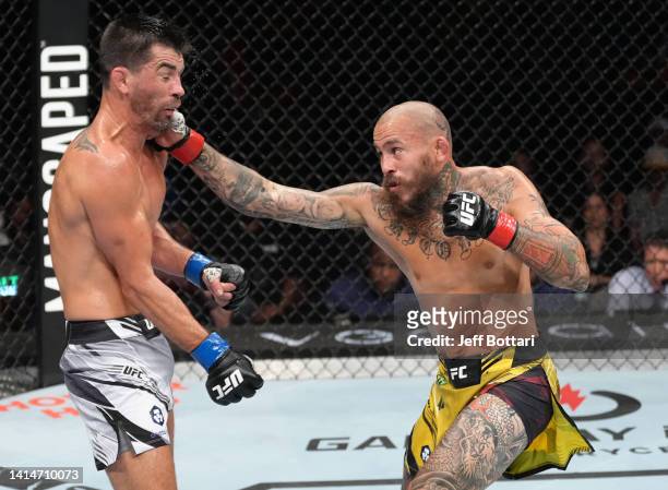 Marlon Vera of Ecuador punches Dominick Cruz in a bantamweight fight during the UFC Fight Night event at Pechanga Arena on August 13, 2022 in San...