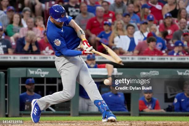 Patrick Wisdom of the Chicago Cubs breaks his bat in the fourth inning against the Cincinnati Reds at Great American Ball Park on August 13, 2022 in...