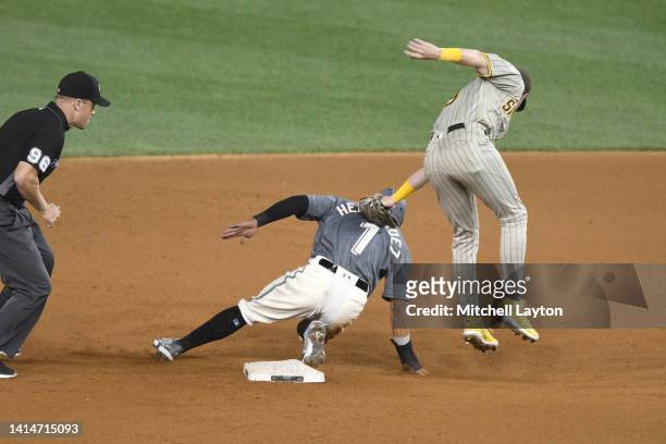 Cesar Hernandez of the Washington Nationals beats the tag by Jake Cronenworth of the San Diego Padres to steal second base base in the seventh inning...