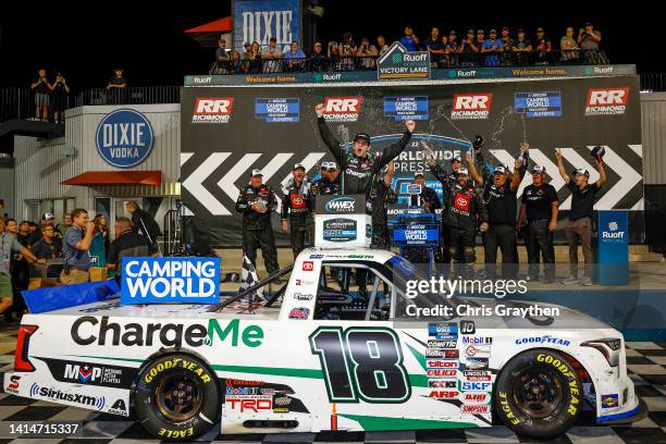 Chandler Smith, driver of the Charge Me Toyota, celebrates in victory lane after winning the NASCAR Camping World Truck Series Worldwide Express 250...