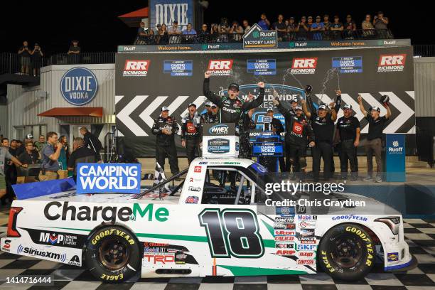 Chandler Smith, driver of the Charge Me Toyota, celebrates in victory lane after winning the NASCAR Camping World Truck Series Worldwide Express 250...