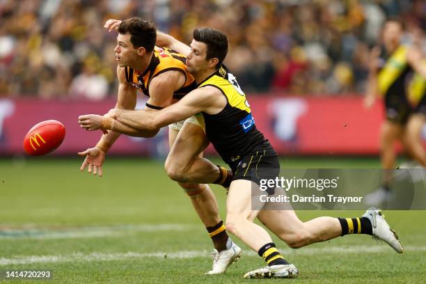 Trent Cotchin of the Tigers tackles Jaeger O'Meara of the Hawks during the round 22 AFL match between the Richmond Tigers and the Hawthorn Hawks at...