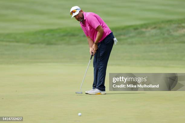 Erik Compton of the United States watches his putt on the 16th hole during the third round of the Pinnacle Bank Championship presented by Aetna at...