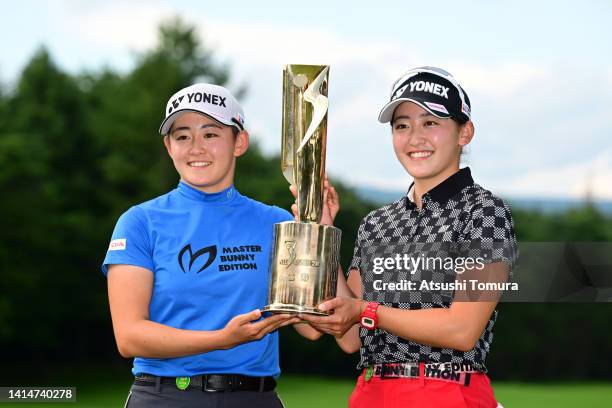 Chisato Iwai of Japan poses with her sister Akie after winning the tournament following the final round of NEC Karuizawa 72 Golf Tournament at...