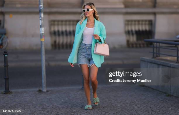 Mandy Bork seen wearing Louis Vuitton Capucines BB rose leather handbag, Hermès Oran fluffy mint green sandals, The Frankie Shop baby blue oversized...