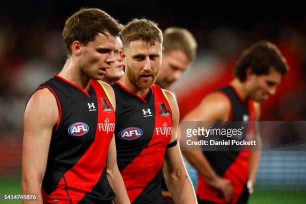 Dyson Heppell of the Bombers chats with Jordan Ridley of the Bombers at half time during the round 22 AFL match between the Essendon Bombers and the...