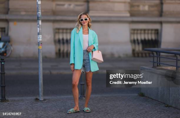 Mandy Bork seen wearing Louis Vuitton Capucines BB rose leather handbag, Hermès Oran fluffy mint green sandals, The Frankie Shop baby blue oversized...