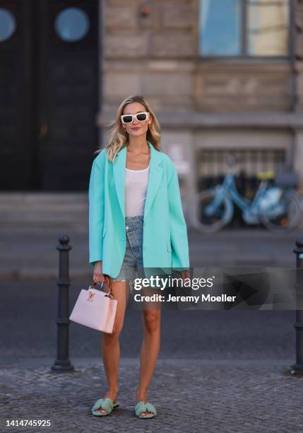 Mandy Bork seen wearing Louis Vuitton Capucines BB rose leather handbag, Hermès Oran fluffy mint green sandals, The Frankie Shop baby blue oversized...