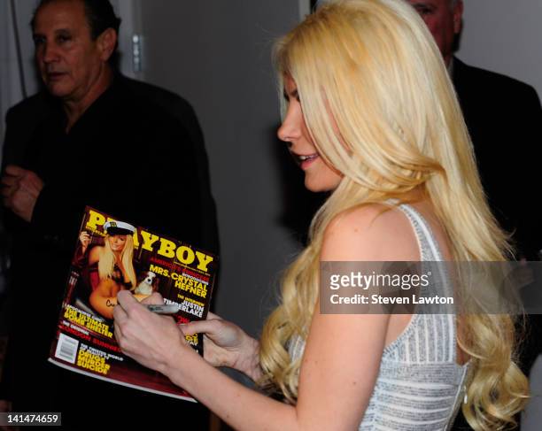 Model Crystal Harris signs autographs as she arrives to host a night at Crazyhorse III and Posh Boutique Nightclub on March 16, 2012 in Las Vegas,...