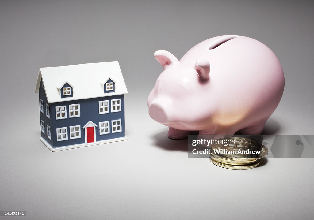 Piggy bank, coins and home