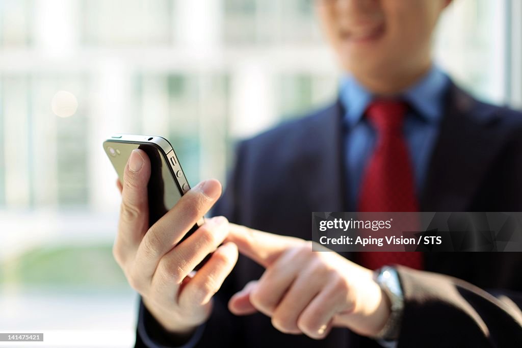 Businessman using mobile phone