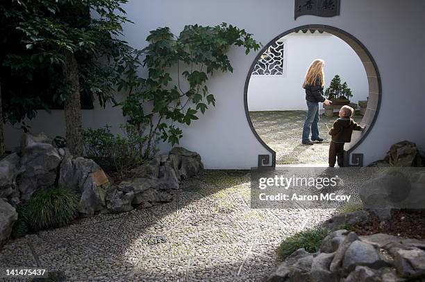 this is - parents and kids chinese garden stock pictures, royalty-free photos & images