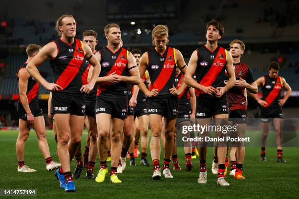 The Bombers look dejected after the round 22 AFL match between the Essendon Bombers and the Port Adelaide Power at Marvel Stadium on August 14, 2022...