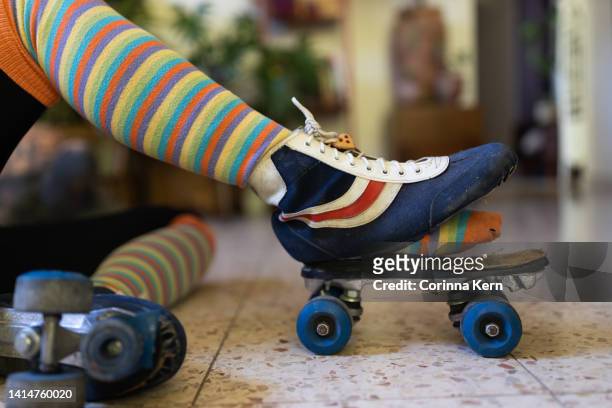 woman wearing torn vintage roller skates - broken heel stock-fotos und bilder