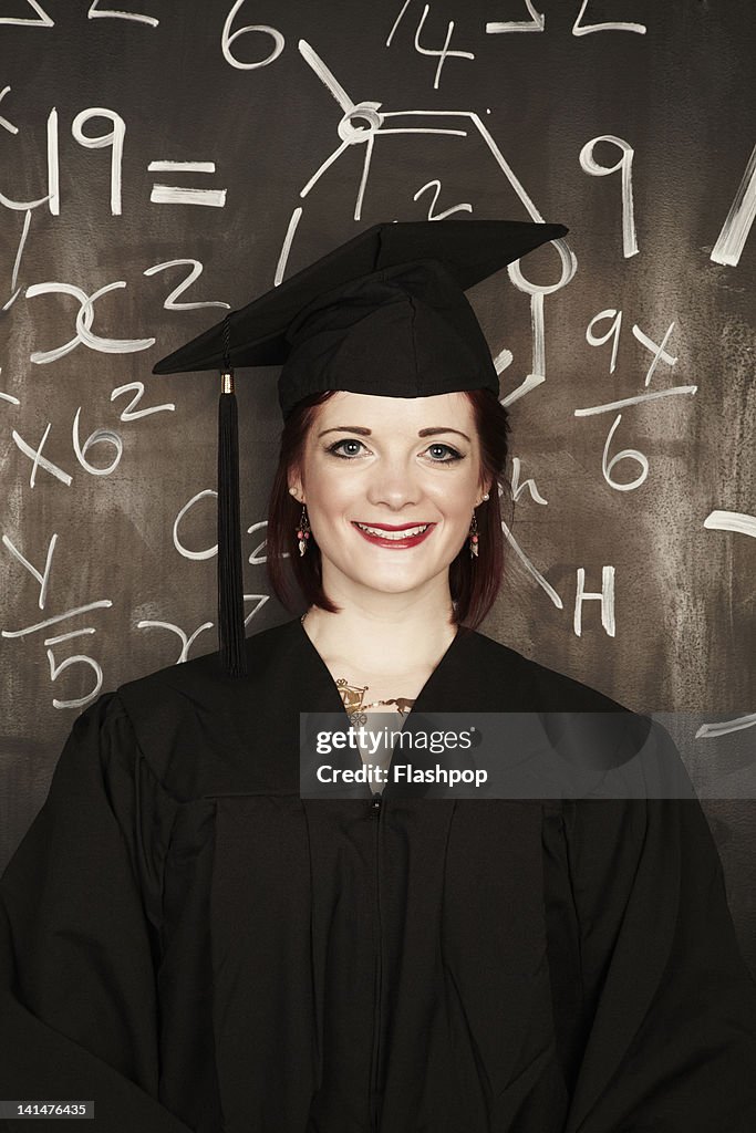 L Graduation Portrait Of Woman Wearing Graduation Cap And Gown High-Res Stock Photo ...