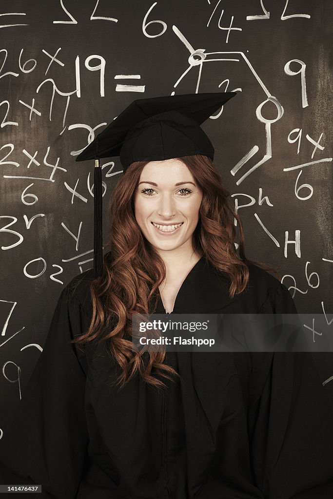 L Graduation Portrait Of Woman Wearing Graduation Cap And Gown High-Res Stock Photo ...