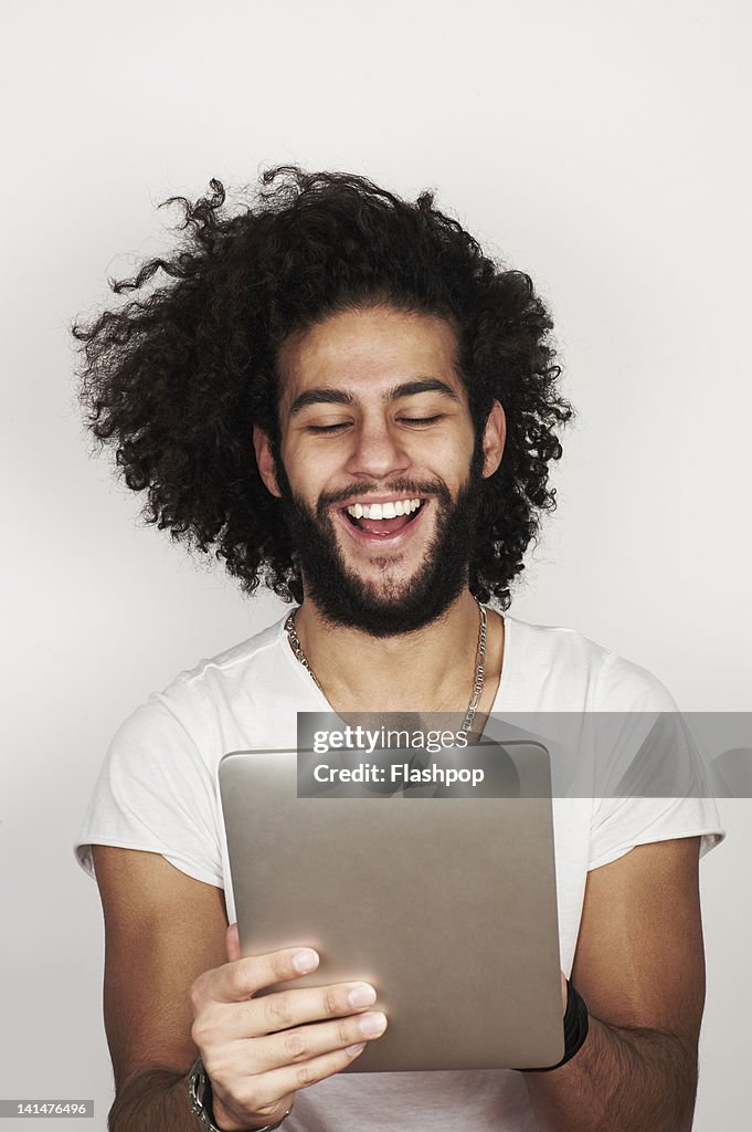 Portrait of man using digital tablet