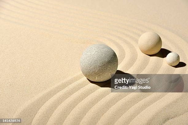 various types of ball and wave pattern in the sand - zen balance stock pictures, royalty-free photos & images