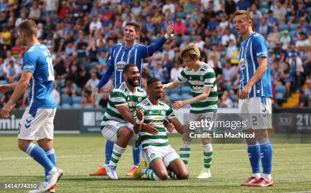 Moritz Jenz of Celtic is congratulated by team mates after he scores his team's third goal during the Cinch Scottish Premiership match between...