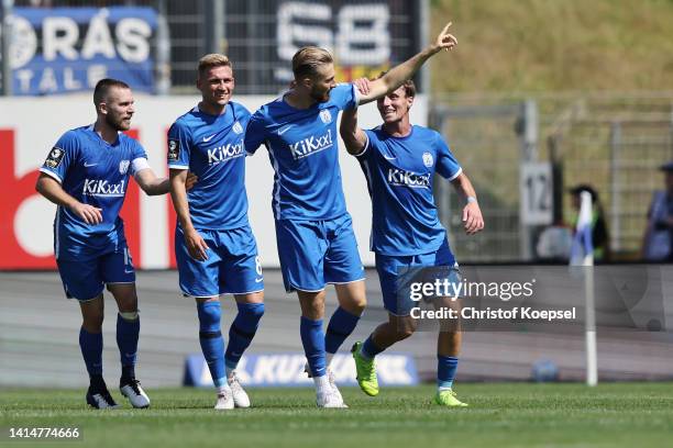 Ole Kaeuper of Meppen celebrates with teammates after scoring his team's third goal during the 3. Liga match between SV Meppen and SV Waldhof...