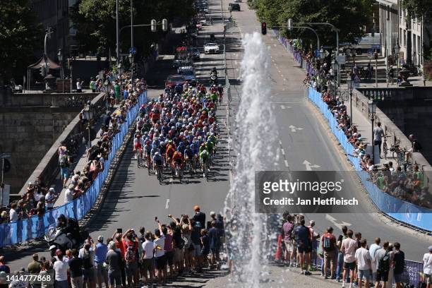 General view of the peloton passing through Munich streets while fans cheer during the 28th UEC Road Cycling European Championships 2022 - Men's Road...