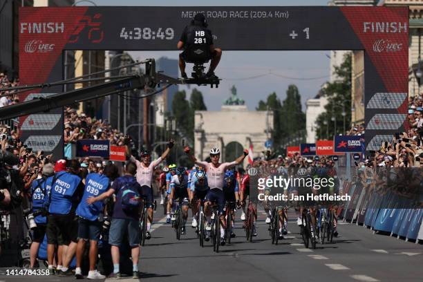 Fabio Jakobsen of Netherlands celebrates at finish line as race winner ahead of Arnaud Demare of France and Tim Merlier of Belgium during the 28th...
