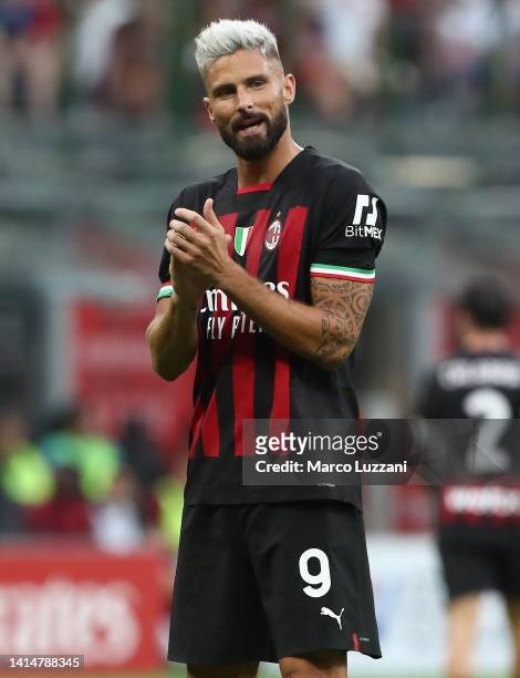 Olivier Giroud of AC Milan applauds during the Serie A match between AC MIlan and Udinese Calcio at Stadio Giuseppe Meazza on August 13, 2022 in...