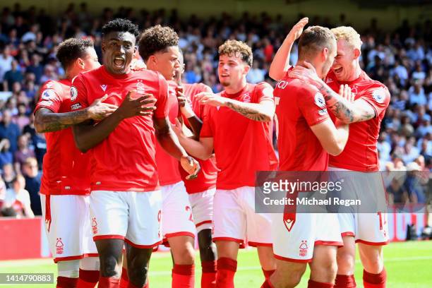 Taiwo Awoniyi of Nottingham Forest celebrates with team mates after scoring their sides first goal during the Premier League match between Nottingham...