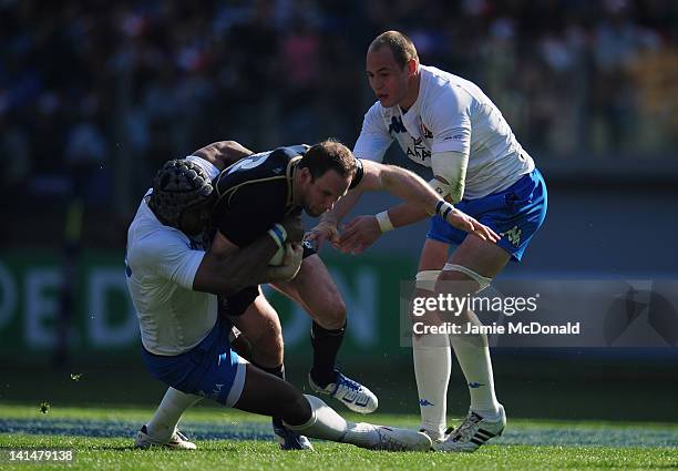 Manoa Vosawai of Italy tackles Graeme Morrison of Scotland during the RBS Six Nations match between Italy and Scotland at Stadio Olimpico on March...