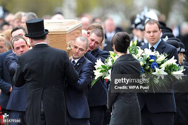 The coffin of Pc David Rathband is carried from Stafford Crematorium on March 17, 2012 in Stafford, England. PC Rathband who was shot and blinded by...