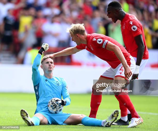 Dean Henderson of Nottingham Forest reacts after saving a penalty taken by Declan Rice of West Ham United during the Premier League match between...