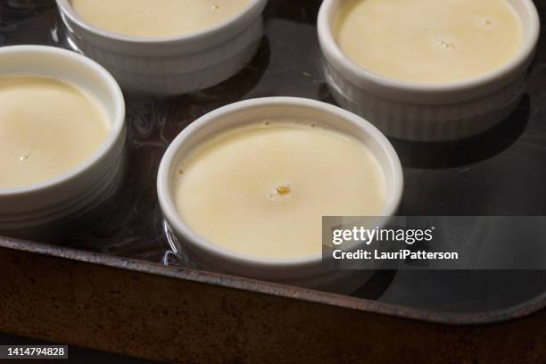 preparing classic creme brulee - baking dish stock pictures, royalty-free photos & images