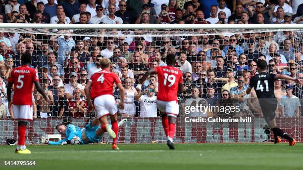 Dean Henderson of Nottingham Forest saves a penalty taken by Declan Rice of West Ham United during the Premier League match between Nottingham Forest...