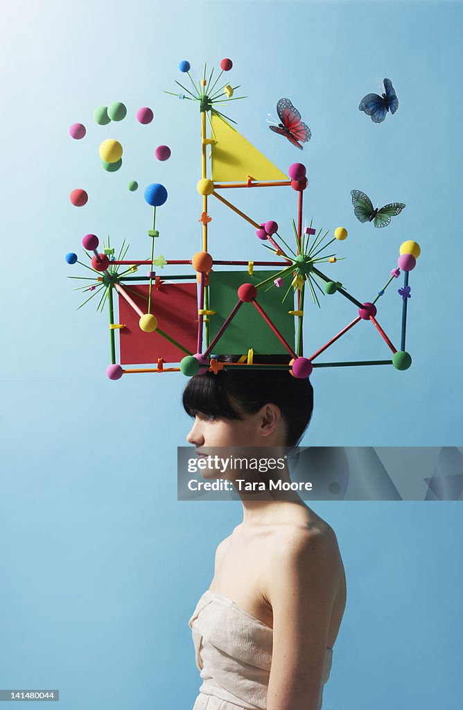 Woman with colorful headpiece with balls