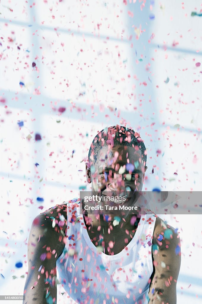 Man getting covered in confetti