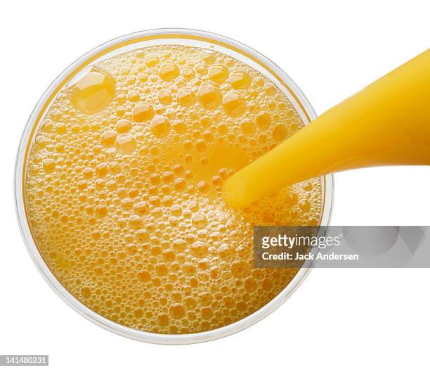 breakfast beverage pour overhead - orangensaft stock-fotos und bilder