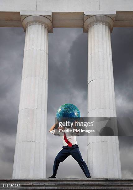 businessman as atlas - man with big balls stock pictures, royalty-free photos & images