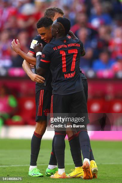 Jamal Musiala of Bayern Munich celebrates after scoring their side's first goal with Sadio Mane during the Bundesliga match between FC Bayern München...