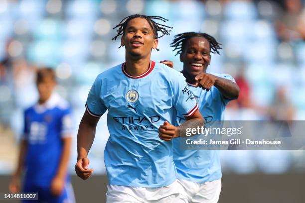 Jadel Katongo of Manchester City celebrates with Adedire Mebude after scoring his side's third goal during the Premier League 2 match between...