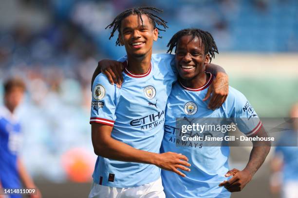 Jadel Katongo of Manchester City celebrates with Adedire Mebude after scoring his side's third goal during the Premier League 2 match between...