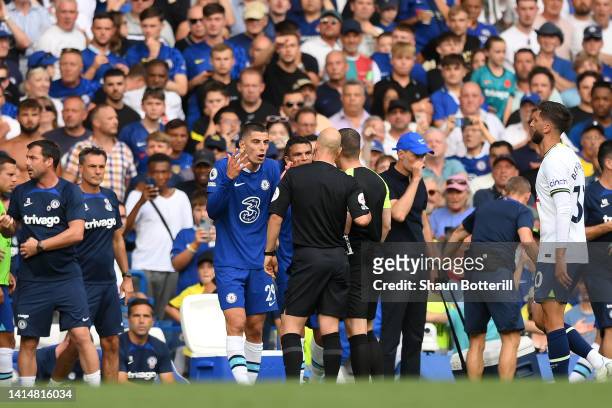 Kai Havertz of Chelsea interacts with match referee Anthony Taylor during the Premier League match between Chelsea FC and Tottenham Hotspur at...