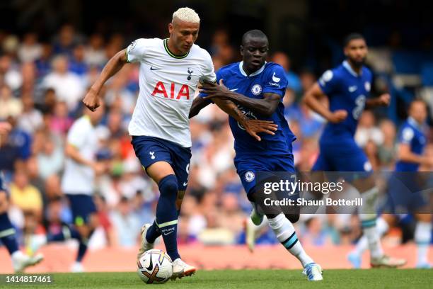 Richarlison of Tottenham Hotspur is challenged by Ngolo Kante of Chelsea during the Premier League match between Chelsea FC and Tottenham Hotspur at...