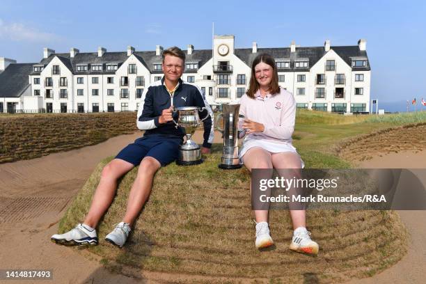 Albert Hansson of Sweden winner of the Boys' Amateur Championship poses with Lottie Woad of England, winner of The Girls' Amateur Championship during...