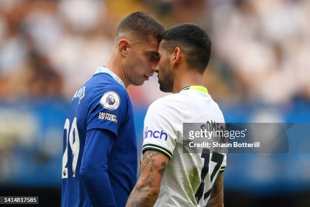 Kai Havertz of Chelsea clashes with Cristian Romero of Tottenham Hotspur before receiving a yellow card during the Premier League match between...